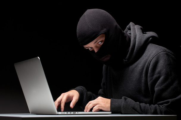 Computer hacker in a balaclava - Photo, Image