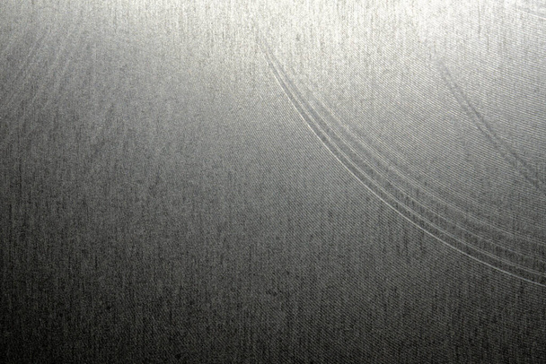 Closeup realistic gray stainless steel flat part in partial focus after industrial CNC processing at high contrast light - Fotó, kép
