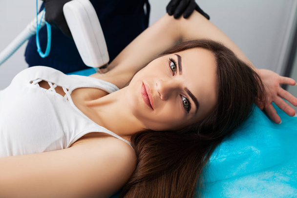 Woman getting laser treatment in a beauty salon. - Fotografie, Obrázek