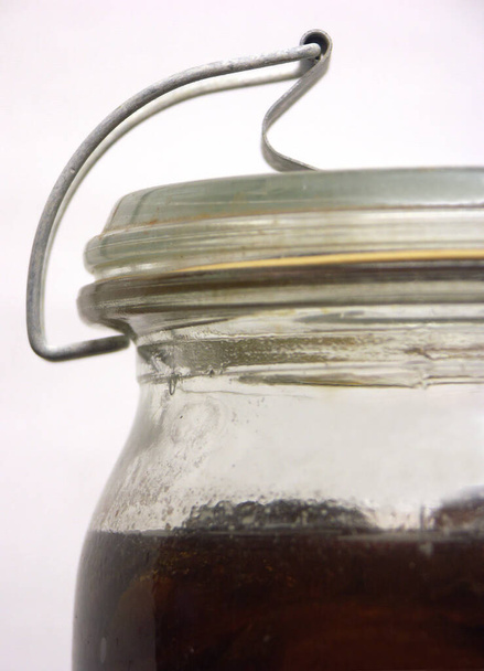 close up of a glass jar with a spoon - Fotoğraf, Görsel
