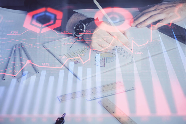 Double exposure of mans hands writing notes of stock market with forex chart. - Photo, Image