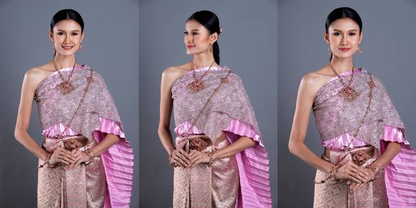 Różowy Lotos Sukienka tajskiego tradycyjnego stroju lub Azji Południowo-Wschodniej złota sukienka w Azji Kobieta z dekoracji stoisko portret w wielu pozach pod oświetleniem Studio szare tło, collage group pack - Zdjęcie, obraz