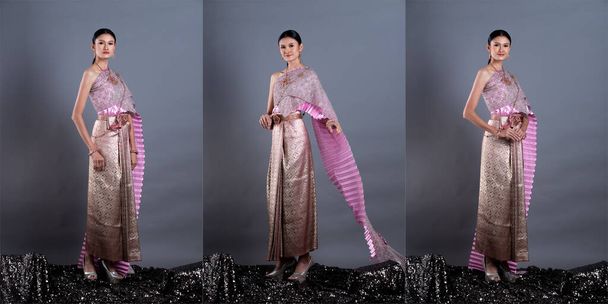 Pink Lotus Dress of Thai Traditional Costume або Південно-Східно-Азійська золота сукня в азіатській жінці з портретом стенду в багатьох положеннях під Studio light grey background, colage group pack - Фото, зображення