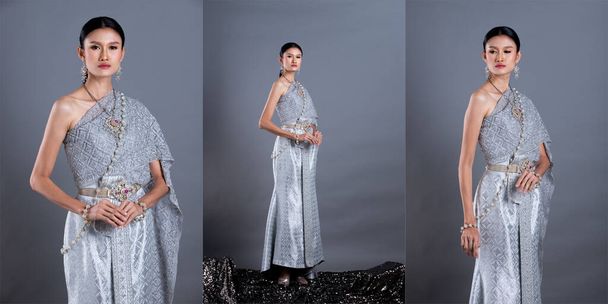 Robe en argent bleu de costume traditionnel thaïlandais ou robe en or d'Asie du Sud-Est en femme asiatique avec stand de décoration dans de nombreuses poses sous éclairage Studio fond gris, groupe de collage pack
 - Photo, image