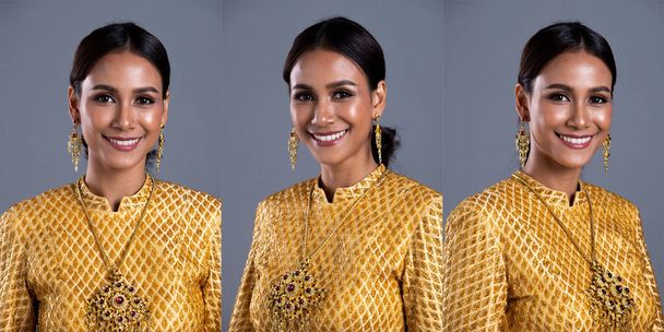 Золотий одяг тайського традиційного костюму або золотий одяг Південно-Східної Азії в азіатській жінці з портретом декору в багатьох положеннях під прикриттям студії освітлення сірого фону, пакет колажів - Фото, зображення