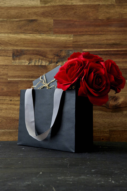 A studio photo of a black gift bag - Foto, Imagem