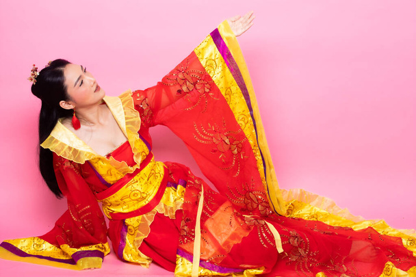 Red Gold lace of Chinese Traditional Costume Opera or South East Asia Reddish Dress in Asian Woman with decoration portrait in many poses under Studio lighting Pink background, collage group pack - Foto, afbeelding