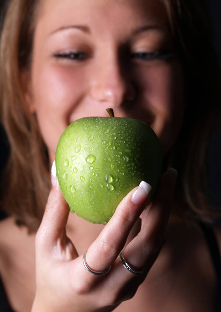 young woman with green apple - Фото, зображення