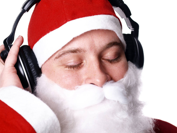 Santa Claus listens to music - Foto, imagen