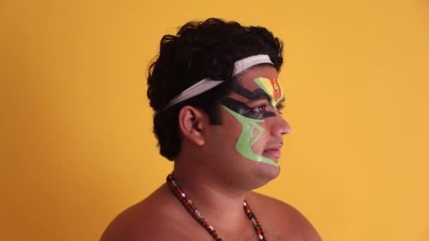 Kathakali dancer showing his initial stage of makeup.  - Footage, Video