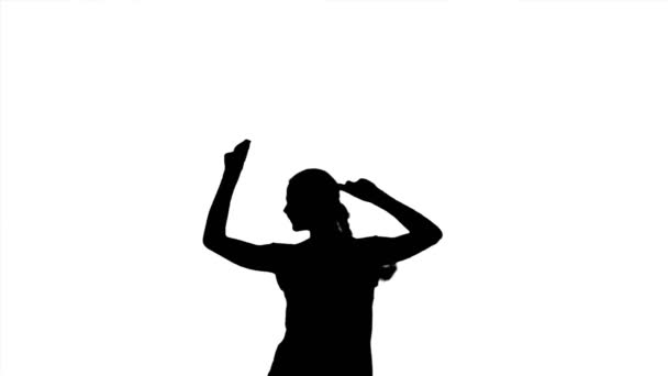 Tleskající žena, tleskající ruce, mávající rukama. Černá silueta ženy na bílém pozadí. - Záběry, video