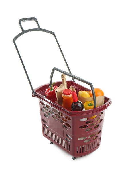 Shopping basket full of different products isolated on white - Fotoğraf, Görsel