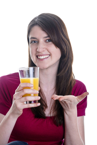 Woman drinks a glass of juice - Foto, afbeelding