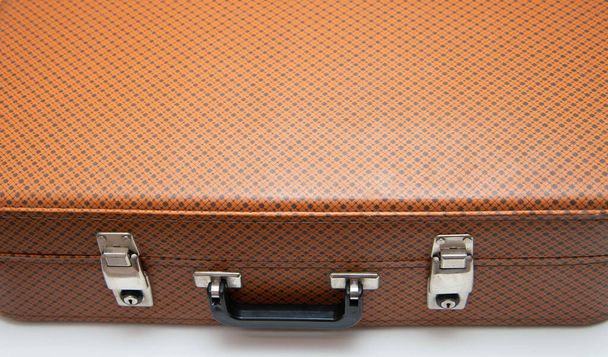 Retro vintage suitcase of a traveler. Close up of vintage leather suitcase - 写真・画像