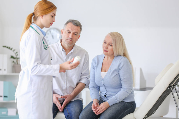 Mature couple visiting doctor in clinic - Photo, Image