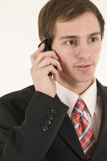 young businessman with a phone - Foto, afbeelding