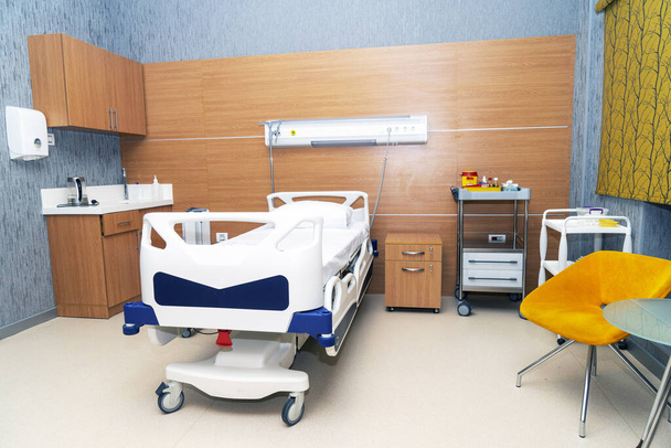 Hospital room with beds and comfortable medical equipped in a modern hospital - Фото, зображення