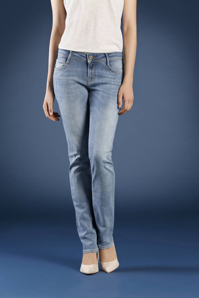 cropped view of woman posing in jeans in studio, fashion concept  - Foto, immagini