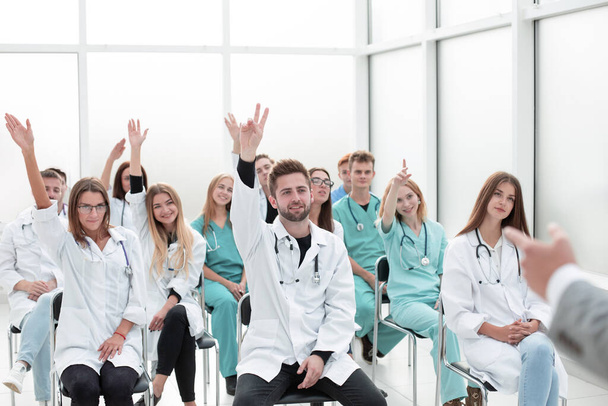 top view. a group of smiling doctors pointing at you. - Foto, immagini