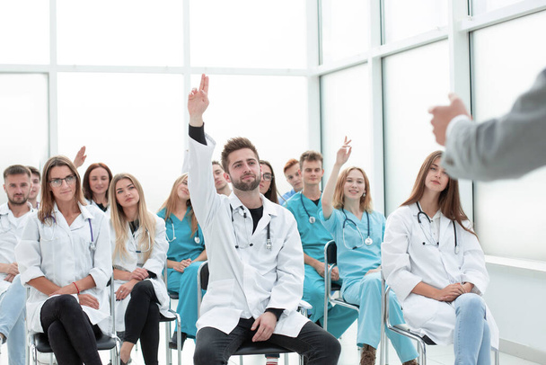 top view. a group of smiling doctors pointing at you. - Foto, Bild
