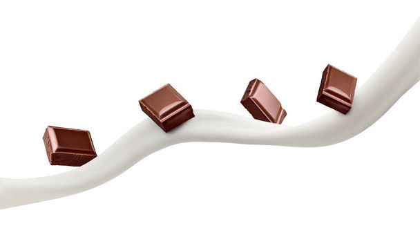 perto de umas partes de chocolate e leite no fundo branco - Foto, Imagem