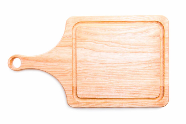 Panneau en bois pour couper des produits isolés sur un fond blanc
. - Photo, image