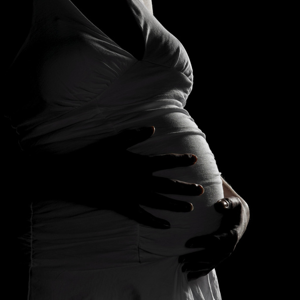 Silhouette einer schwangeren Frau - Foto, Bild
