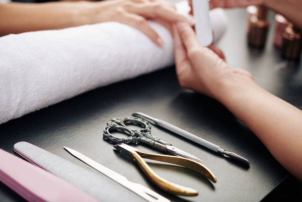 Close-up image of tools on table of professional manicurist - Foto, Bild