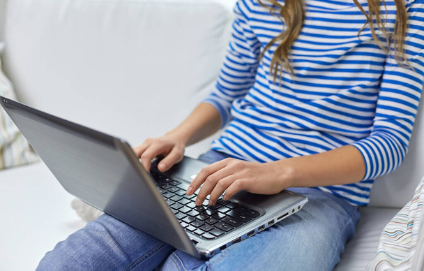 teenage student girl with laptop and books at home - Фото, изображение