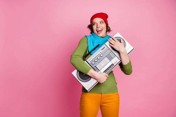 Cool crazy energetic girl hug boombox enjoy playing retro music look copyspace rejoice scream wear yellow pants trousers jumper style stylish outfit isolated pink color background - Photo, image