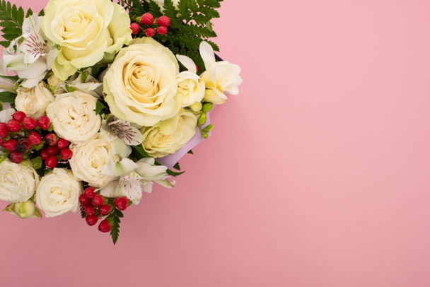 top view of bouquet of flowers on pink background - Zdjęcie, obraz
