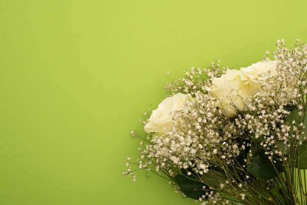 top view of fresh bouquet of flowers isolated on green - Photo, Image