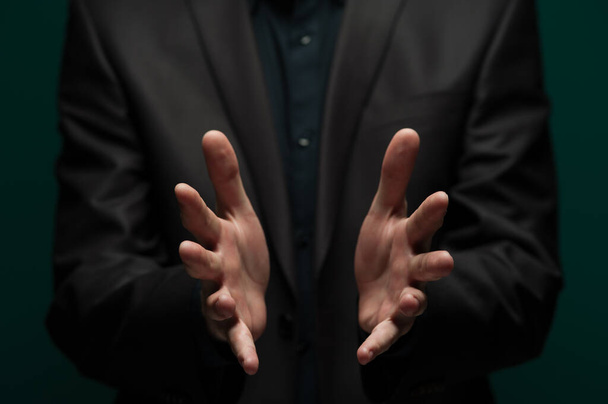 Man holding an invisible object on palms - Photo, image