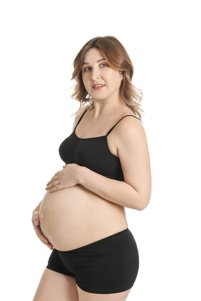 Beautiful pregnant woman on white background - 写真・画像
