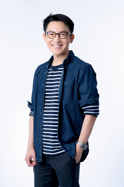 smart attractive asian glasses male standing and smile with freshness and joyful casual blue shirt portrait white background - Foto, imagen