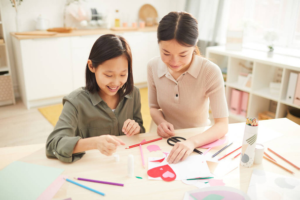 Cheerful Girls Creating Holiday Cards - 写真・画像