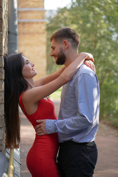 Beautiful couple of man and woman on the background of a wonderful architectural solution. Romantic theme with a girl and a guy. Spring, summer photo relationship, love, Valentine's day - Fotoğraf, Görsel