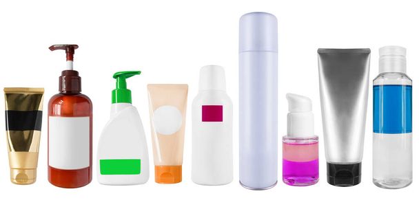 Collection of colorful cosmetic bottles and tubes on white background - Foto, afbeelding