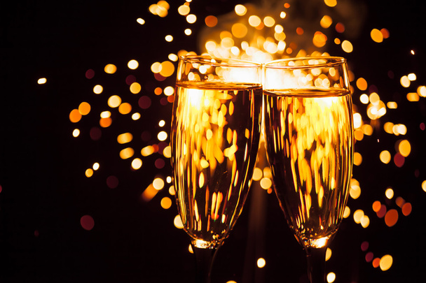 champagne glass against christmas sparkler background - Photo, Image