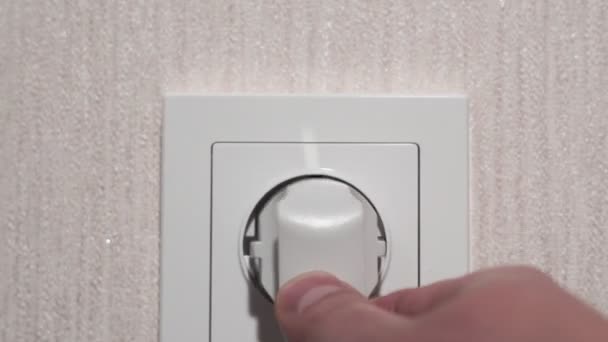 Inserting Power Plug into an Electricity Socket - Materiał filmowy, wideo