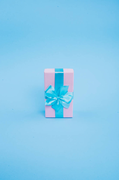 Blue-pink gift on a blue background. - Φωτογραφία, εικόνα