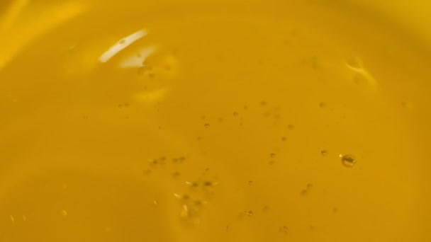 Oil drops and ripple. Drops of oil falling in pond and making ripple. Slow motion. Shot video. - Video, Çekim