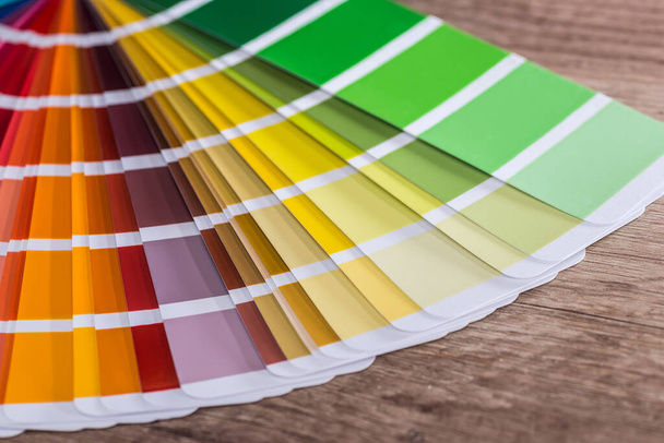 Colour swatch on wooden table as background - Photo, Image