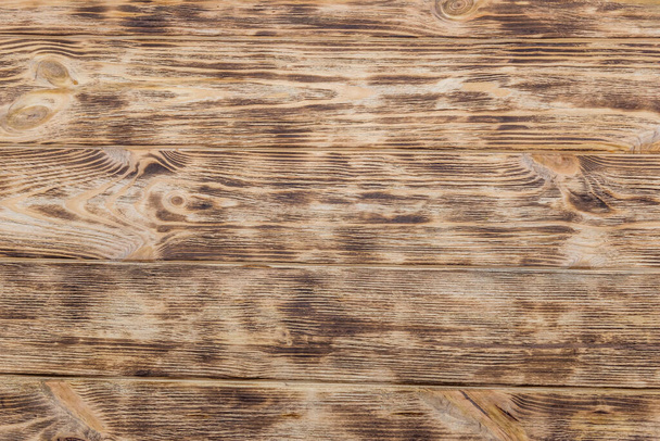 Getextureerde houten plank gebruikt als achtergrond close-up - Foto, afbeelding
