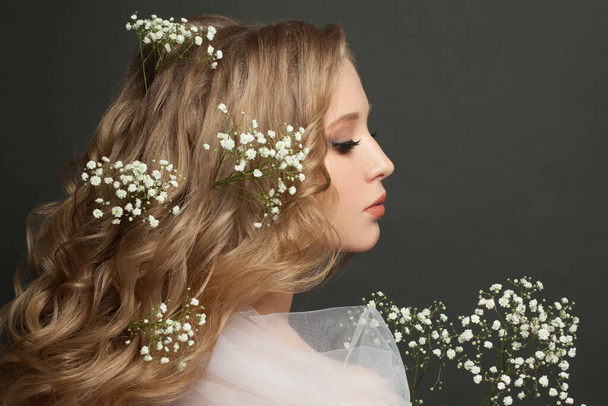 Pretty female profile with white flowers on black banner background - Foto, imagen