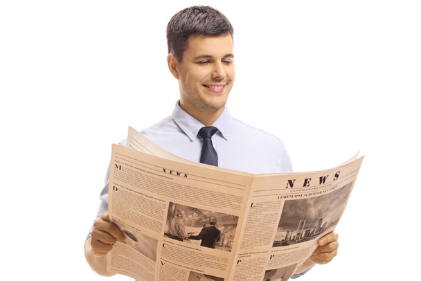 Man reading a newspaper isolated on white background - Zdjęcie, obraz