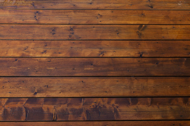 Stained wet deck wooden boards with water drops, brown planks texture - Photo, Image