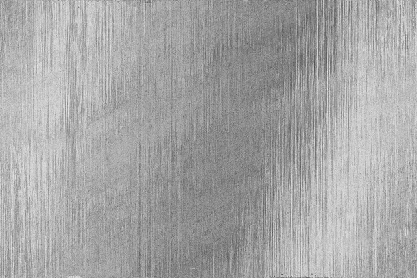 Brushed scratched metal texture. Polished stainless steel plate with light reflection. - Photo, Image