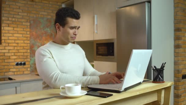 Businessman feeling back pain, typing on laptop, sedentary lifestyle, disease - Metraje, vídeo