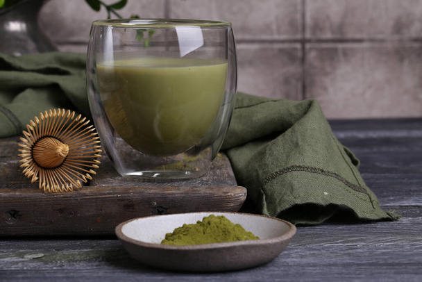 green japanese matcha tea on a wooden table - Fotoğraf, Görsel